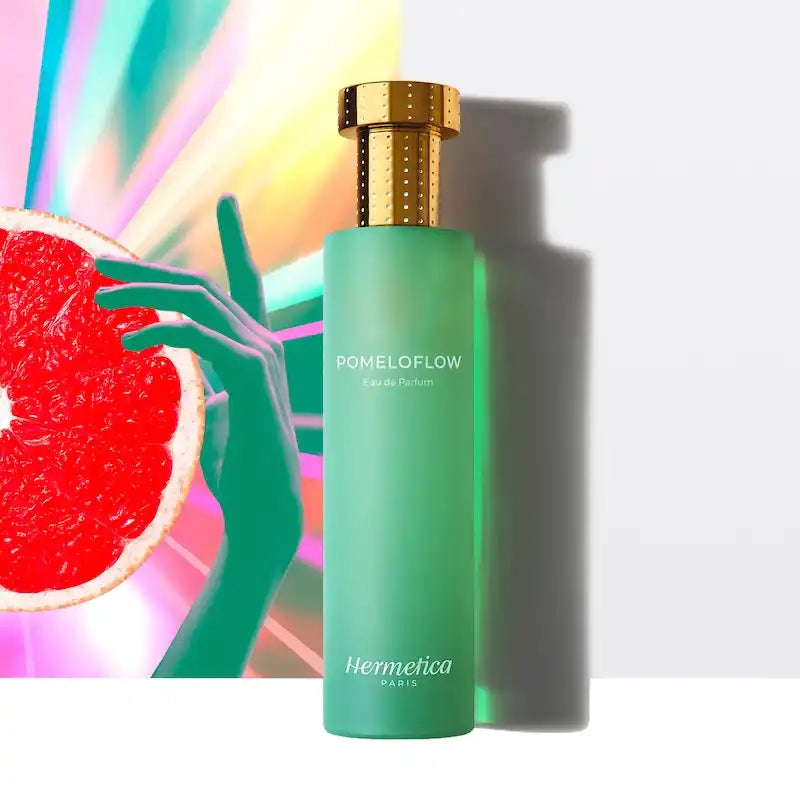 Mint green bottle with a gold cap labeled ’Pomeloflow’ by Hermetica.