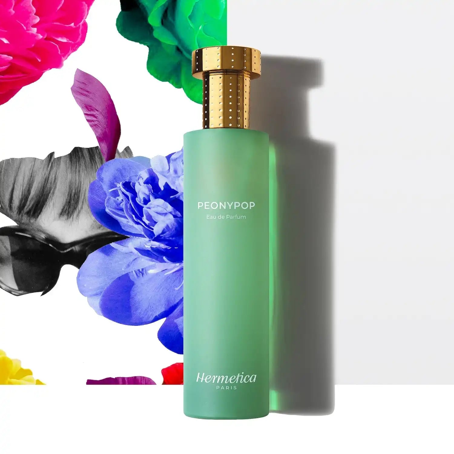 Mint green perfume bottle with a gold cap labeled ’Peonypop’ by Hermetica.